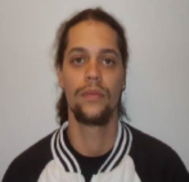 Male fugitive Erric Jeffery Roman wearing jacket